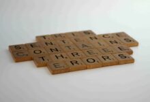 a group of wooden letters arranged in a crossword puzzle